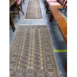 AN EASTERN STYLE RUNNER AND A SIMILAR PALE GROUND EASTERN RUG. THE RUNNER 345 X 70CMS, THE OTHER 159