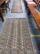 AN EASTERN STYLE RUNNER AND A SIMILAR PALE GROUND EASTERN RUG. THE RUNNER 345 X 70CMS, THE OTHER 159