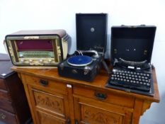 A VINTAGE REMINGTON COMPACT PORTABLE TYPEWRITER, A PORTABLE GRAMOPHONE, AND A A 1950'S VALVE RADIO.