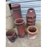 THREE LARGE AND TWO SMALL CHIMNEY POTS.