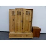 AN ANTIQUE CONTINENTAL PINE KNOCK DOWN WARDROBE WITH TWO DRAWER BASE. W143 X D 59CMS.