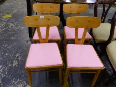 A SET OF FOUR MID CENTURY RETRO KITHCEN CHAIRS WITH LATER PINK LEATHERETTE SEAT PADS.