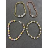 FOUR ASSORTED SILVER BRACELETS WITH YELLOW, AND ROSE GOLD GILT. THREE EXPANDING STACKER BRACELETS