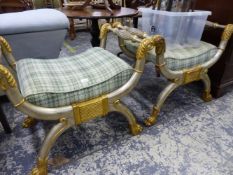 A PAIR OF SILVER AND GILT DECORATED X FORM STOOLS.