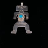 SILVER AMERICAN INDIAN NAVAJO TURQUOISE SET STYLISED FIGURE.
