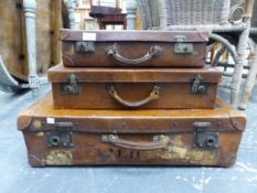 THREE VINTAGE SUITCASES.