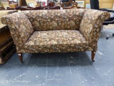 AN EDWARDIAN DOUBLE DROP ARM SMALL COTTAGE SETTEE ON SQUARE TAPER LEGS.