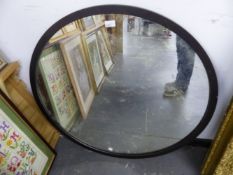 A LARGE CIRCULAR METAL FRAMED WALL MIRROR. DIAMETER 90CMS.