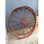 A PAIR OF IRON CART WHEELS.