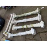 A SET OF SIX LARGE CAST CLASSICAL COLUMNS.