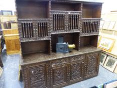 A CARVED HARDWOOD SIDE CABINET WITH RAISED RACK OVER. W 195 X D 46 X H 191CMS.