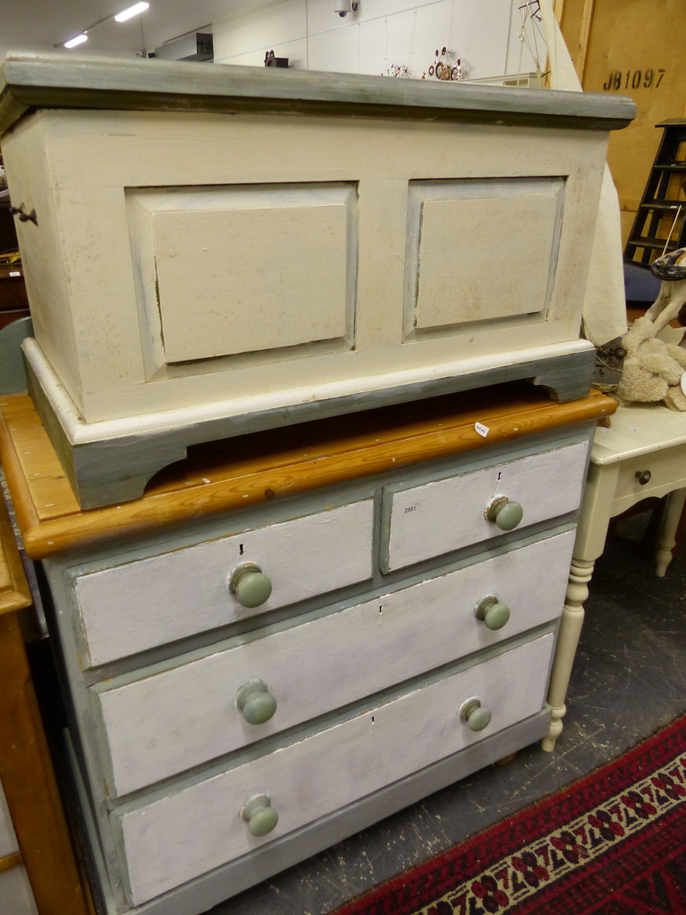 AN ANTIQUE PAINTED PINE CHEST OF DRAWERS, A PINE OTTOMAN, AND A SIDE TABLE...