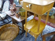 A PAIR OF MID CENTURY BEDSIDE CABINETS, TOGETHER WITH A HARD WOOD OCCASIONAL TABLE ON TRESTLE ENDS.