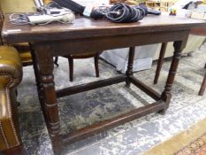 A 17th.C. AND LATER OAK SIDE TABLE ON TURNED LEG WITH STRETCHER BASE.