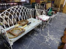 A WROUGHT IRON REGENCY STYLE GARDEN SEAT, ANOTHER GARDEN BENCH WITH A SQUAB CUSHION, AND A