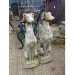 A PAIR OF LARGE SEATED LURCHER GATEPOST FINIALS.