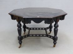 AN EBONISED OCTAGONAL TABLE WITH A WAVY APRON ABOVE THE SPIRALLY FLUTED BALUSTER LEGS JOINED BY ARCH