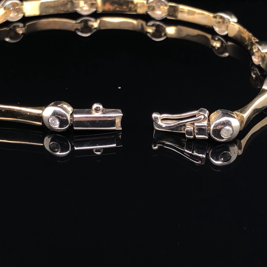 A 9ct YELLOW GOLD AND DIAMOND BAR AND RUB OVER SET BRACELET LENGTH 19.5.cms WEIGHT 11.9gm. - Image 3 of 4