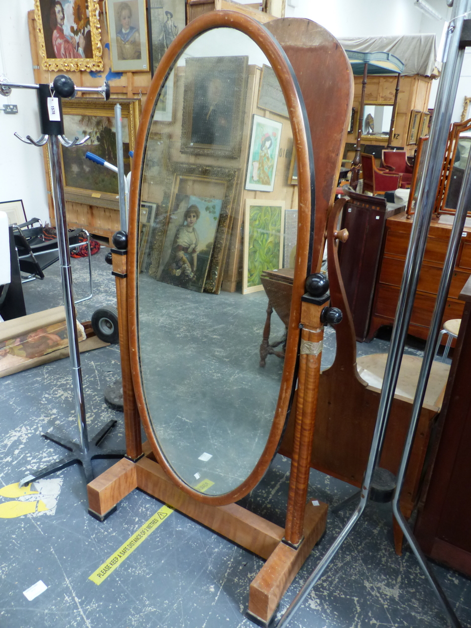 A CONTINENTAL ART DECO SATIN WALNUT CHEVAL MIRROR, WITH EBONISED DETAIL, OVAL PLATE, H. 174 X W.