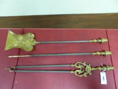 A SET OF THREE BRASS AND STEEL FIRE IRONS, THE BALUSTER HANDLES WITH BELL SHAPED POMMELS