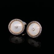 A PAIR OF 14ct YELLOW GOLD AND WHITE GUILLOCHE ENAMEL STONE SET CUFFLINKS. WEIGHT 10.6grms.