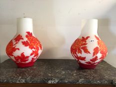 A PAIR OF LARGE DECORATIVE OVERLAY GLASS VASES. H. 42cms.