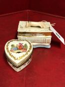 A PARIS PORCELAIN INKSTAND MODELLED AS A LADY'S HAND RESTING ON TWO BOOKS, THE INTERIOR WITH INKWELL