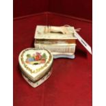 A PARIS PORCELAIN INKSTAND MODELLED AS A LADY'S HAND RESTING ON TWO BOOKS, THE INTERIOR WITH INKWELL