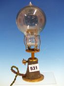 AN EDISWAN-FOCUS 200-100..B LIGHT BULB WIRED TO A BRASS WALL FITTING LIGHT SOCKET. H 23.5cms.