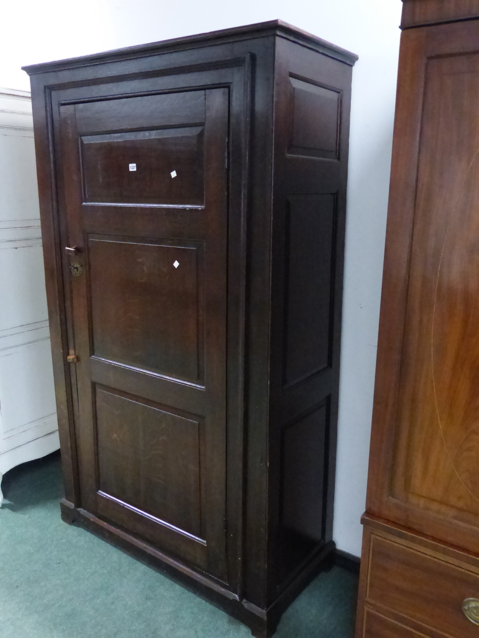 AN 18th C. OAK CUPBOARD WITH THE THREE PANELLED DOOR ENCLOSING HANGING SPACE ABOVE A SHELF AND THE - Image 3 of 10
