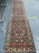 AN ANTIQUE PERSIAN TRIBAL RUNNER, 368 X 93cm.