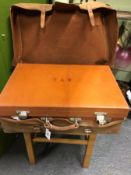 A CALF SUIT CASE WITH SOME 1908/9 LONDON SILVER FITTINGS AND CANVAS OUTER COVER