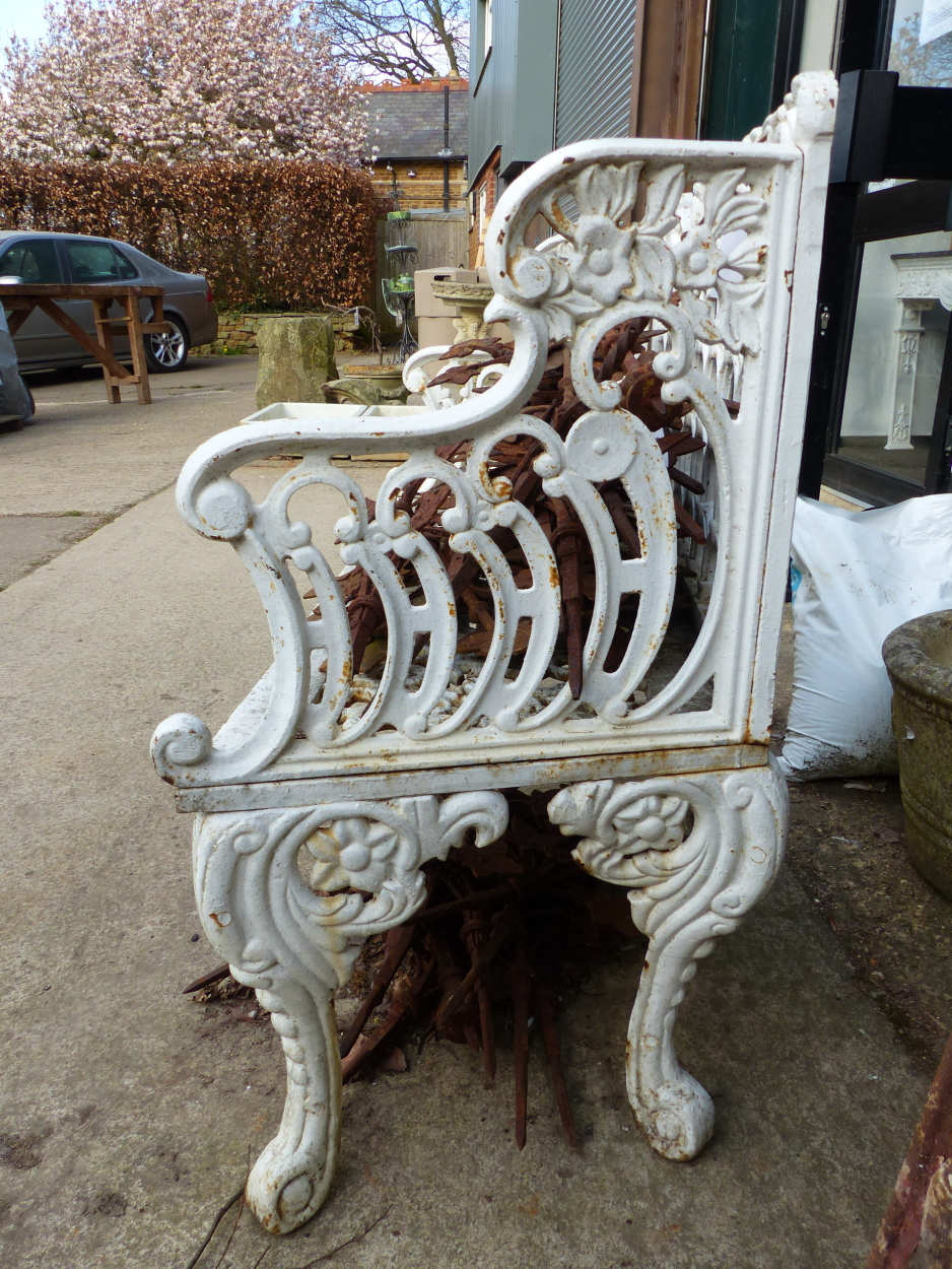 A CAST IRON GARDEN BENCH IN THE COALBROOKDALE TASTE, THE BACK WITH SERPENTINE FOLIATE TOP RAIL ABOVE - Image 2 of 10