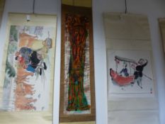 THREE CHINESE SCROLL PAINTINGS, ONE OF TWO FIGURES PROCESSING A GIANT CARP. 60 x 65.5cms. THE SECOND