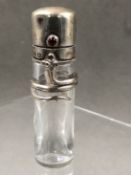 A VICTORIAN SILVER SCENT BOTTLE WITH A GLASS BODY, AND HINGED LID. THE BODY WITH A SILVER SERPENT