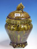 A SARREGUEMINES DEEP OLIVE GREEN GLAZED MAJOLICA VASE AND DRAGON TOPPED COVER WITH SIX SCROLL