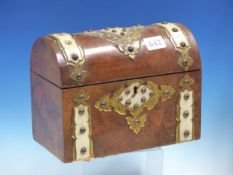 A BURR WALNUT TWO COMPARTMENT TEA CADDY, THE FRONT AND ROUND ARCHED LID WITH GILT METAL FRAMED IVORY
