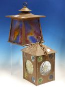 TWO ART NOUVEAU GLAZED COPPER LANTERNS, ONE OF ROOFED SQUARE SECTION INSET WITH CLEAR AND COLOURED