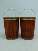 A PAIR OF MAHOGANY PEAT BUCKETS AND METAL LINERS, THE STOP FLUTED TAPERING CYLINDRICAL SIDES