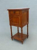 A FRENCH MARBLE TOPPED PINE BEDSIDE CABINET WITH A DRAWER OVER A DOOR AND A TIER JOINING THE