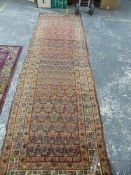 AN ANTIQUE PERSIAN TRIBAL RUNNER, 410 X 112cm.