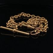 AN 18ct GOLD DOUBLE ALBERT POCKET WATCH CHAIN COMPLETE WITH T-BAR AND SWIVEL CLASP. LENGTH 35.5cms,