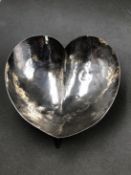 A HALLMARKED SILVER HEART SHAPE HAMMERED THREE FOOTED DISH, DATED 1967 BIRMINGHAM, MAKERS MARK