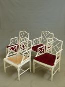 A SET OF FOUR WHITE PAINTED FAUX BAMBOO CHAIRS, COCK PEN BACKS AND ARM SUPPORTS ABOVE CANED SEATS