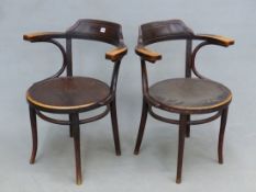 A PAIR OF VINTAGE LABELLED THONET BENTWOOD ARMCHAIRS, CIRCULAR SEATS WITH SHELL DESIGN.