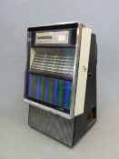 A MODEL ESB100 SEEBURG STENCO PHONOGRAPH JUKE BOX WITH A SELECTOR OF NAMED 45RPM SINGLES AND A BLUE,