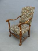 A CHARLES II STYLE BEECH WOOD ELBOW CHAIR WITH FLORAL UPHOLSTERED RECTANGULAR BACK AND SEAT