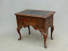 AN ANTIQUE AND LATER GEORGIAN WALNUT LOWBOY, INSET LEATHER TOP ABOVE THREE DRAWERS. H. 71 x W. 81