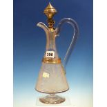 A WHITE METAL MOUNTED CLEAR GLASS CLARET JUG, THE CONICAL BODY ETCHED WITH FLOWERS AND FOLIAGE AND