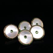 A SET OF FIVE 9ct GOLD AND ENAMEL BUTTONS IN A FITTED CASE. WEIGHT 6.5grms.